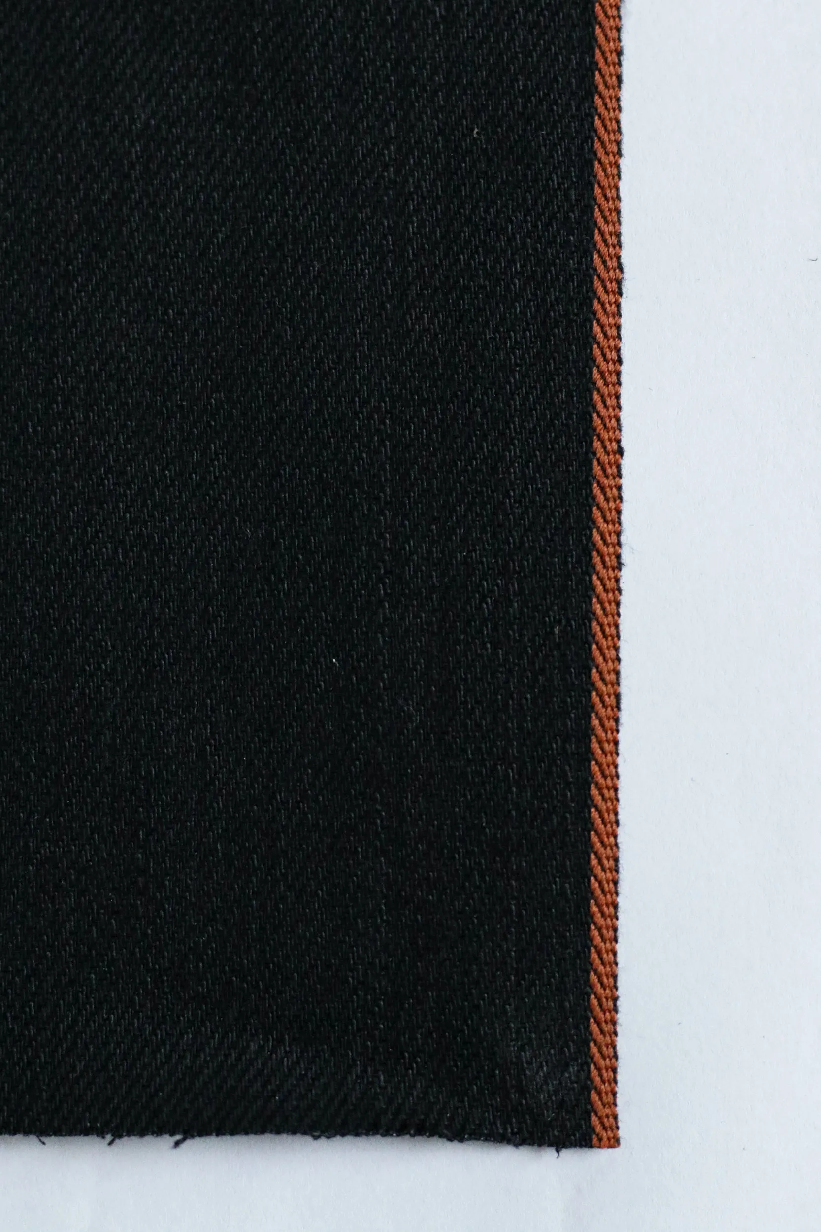 SMOOTH DOUBLE BLACK SELVEDGE DENIM BURNT ORANGE ID